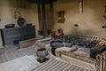 A dark room inside ancient Baltit fort display antique appliances, Pakistan.