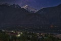 Gilgit City Center View and Saddar Bazaar at night with the sky furrowed by star trails