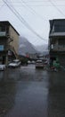 Gilgit city view after rain. Market and mountains in background partiality blurred