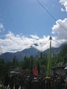 Gilgit, Pakistan : 28-August-2023, Chehlum Julus of Imam Hussain in Hunza valley.Mob of people with flags . Mountain area