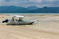 A wooden boat on a small beach on the tropical tourist island of Gili Air off the coast of Royalty Free Stock Photo