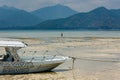 A wooden boat on a small beach on the tropical tourist island of Gili Air off the coast of Royalty Free Stock Photo