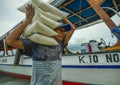 Boats supply 24/7 all kind of stuff to compensate the lack of resources of the island. Here the crew unloading rice