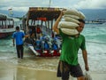 Boats supply 24/7 all kind of stuff to compensate the lack of resources of the island. Here the crew unloading rice