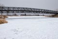 Bridge over frozen lake Royalty Free Stock Photo