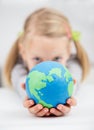 Gilrl holding the earth globe Royalty Free Stock Photo