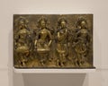 Gilt bronze 15th century relief with four goddesses on display in the Dallas Museum of Art. Royalty Free Stock Photo