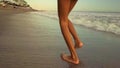 Gimbal steadycam tracking shot of happy and excited Asian Indonesian child girl running carefree on the beach