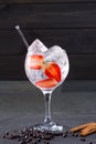 Gin tonic cocktail with strawberries cinnamon and juniper Royalty Free Stock Photo