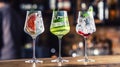 Gin tonic cocktails in wine glasses on bar counter in pup or restaurant