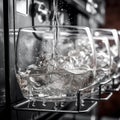 Gin tonic or water are poured transparent glass in bar. Wiskey glass in dishwashing machine