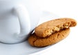 Ginger biscuits with cup and saucer. Royalty Free Stock Photo