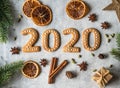 Ginger biscuits of the form of numbers and 2020 new year ginger cookies on grey background. Top view. Seasonal New Year`s Royalty Free Stock Photo