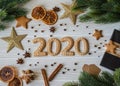 Ginger biscuits of the form of numbers and 2020 new year ginger cookies white wood background. Top view. Seasonal packaging, Royalty Free Stock Photo