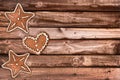 Ginger bread cookies and Christmas ornaments on wooden planks