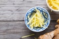 Ginger cut into strips on wooden table Royalty Free Stock Photo