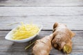 Ginger cut into strips on wooden table Royalty Free Stock Photo