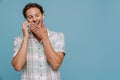 Ginger european man laughing and talking on cellphone