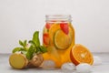 Ginger fruity ice tea with mint in a glass jar, white background Royalty Free Stock Photo