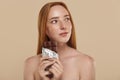 Ginger girl with naked shoulders and chocolate Royalty Free Stock Photo