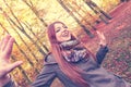 Ginger girl playing in forest. Royalty Free Stock Photo