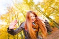 Ginger girl playing in forest. Royalty Free Stock Photo