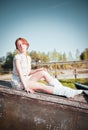 Ginger girl. Portrait of young tender redhead young girl with healthy freckled skin wearing white top looking at camera with Royalty Free Stock Photo