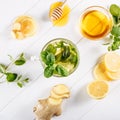 Ginger green tea in a glass for flu cold winter days. Side view on white wooden background decorated with mint, lemon Royalty Free Stock Photo