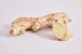 ginger on grey background copy space, ginger root and slices Royalty Free Stock Photo