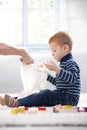 Ginger-haired little boy playing at home Royalty Free Stock Photo