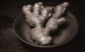 Ginger in bowl on wooden table