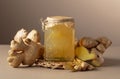 Ginger jam in small square jar and fresh ginger Royalty Free Stock Photo