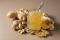 Ginger jam in small square jar and fresh ginger Royalty Free Stock Photo