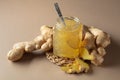 Ginger jam in small square jar and fresh ginger Royalty Free Stock Photo