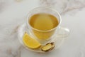 Ginger lemon tea in insulated glass teacup