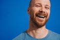 Ginger man with beard laughing and looking at camera Royalty Free Stock Photo