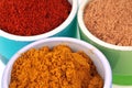 Powdered spices in ramekins in close-up