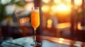 Ginger peach bellini cocktail at sunset on summer terrace Royalty Free Stock Photo