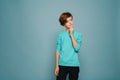 Ginger puzzled boy wearing long sleeve posing and looking aside Royalty Free Stock Photo