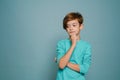 Ginger puzzled boy wearing long sleeve posing and looking aside Royalty Free Stock Photo