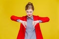 Ginger red head business woman in red suit showing dislike sign. Royalty Free Stock Photo