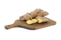 Ginger rhizome with slices on cutting board over white