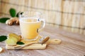 Ginger root and ginger juice with leaf and spoon Royalty Free Stock Photo