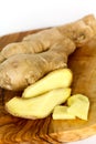 Ginger root, isolated on the wooden background Royalty Free Stock Photo