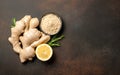 Ginger root, ginger powder and lemon on vintage background Royalty Free Stock Photo