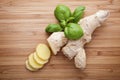 Ginger root sliced on wooden table Royalty Free Stock Photo