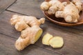 Ginger root sliced on wooden table Royalty Free Stock Photo