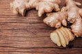 Ginger root sliced on wooden table Royalty Free Stock Photo