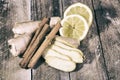 Ginger root sliced on wooden table Royalty Free Stock Photo