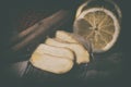 Ginger root sliced on wooden table Royalty Free Stock Photo